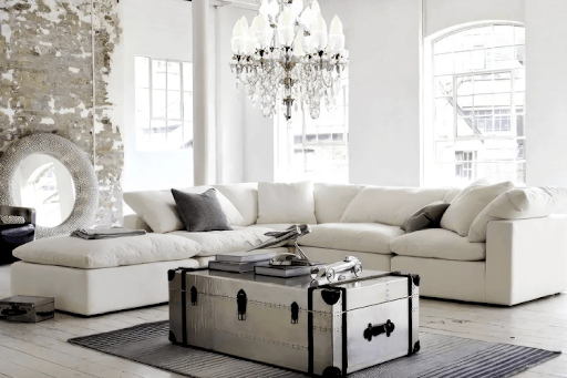 Elegant white modular sectional sofa in a bright living room.